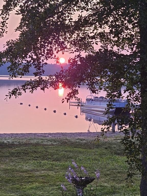 yard at dusk with a water view