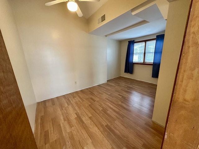 unfurnished room with ceiling fan and hardwood / wood-style flooring