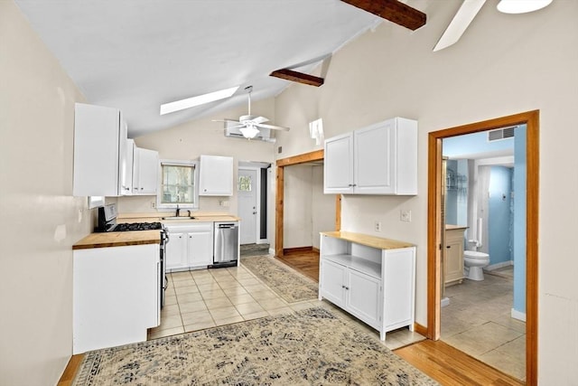 4 Morrison Way, Lakeville, MA 02347 - kitchen featuring appliances with stainless steel finishes, a skylight, white cabinetry, ceiling fan, and high vaulted ceiling