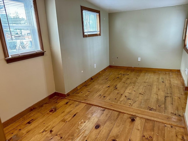 empty room with light hardwood / wood-style floors