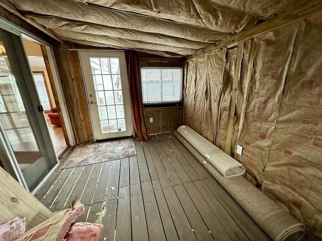 miscellaneous room with hardwood / wood-style flooring and lofted ceiling