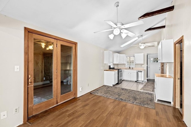 4 Morrison Way, Lakeville, MA 02347 - kitchen featuring stainless steel appliances, a ceiling fan, white cabinetry, light wood finished floors, and beamed ceiling