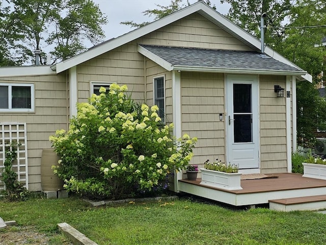 view of outdoor structure featuring a lawn