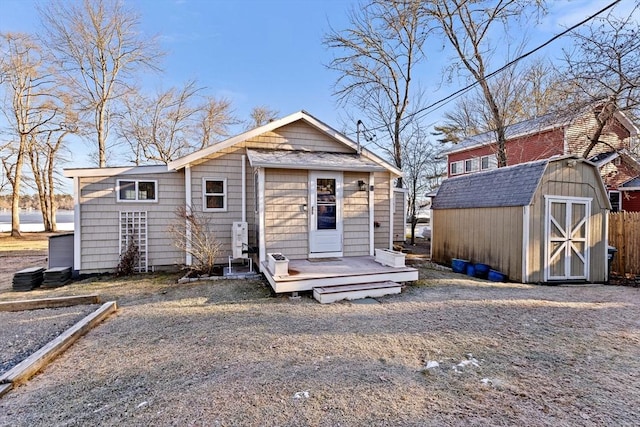 view of front of home with a shed