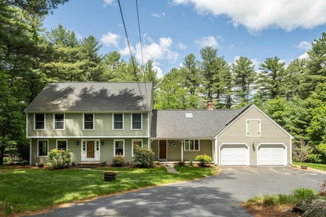 177 S St, Upton, MA 01568 - view of front of property featuring asphalt driveway, an attached garage, a chimney, roof with shingles, and a front lawn