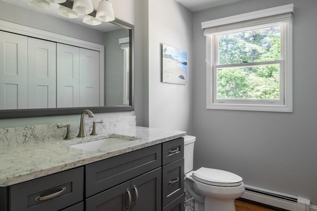177 S St, Upton, MA 01568 - half bath featuring a baseboard radiator, toilet, and vanity