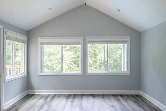 177 S St, Upton, MA 01568 - spare room with vaulted ceiling, wood finished floors, and baseboards