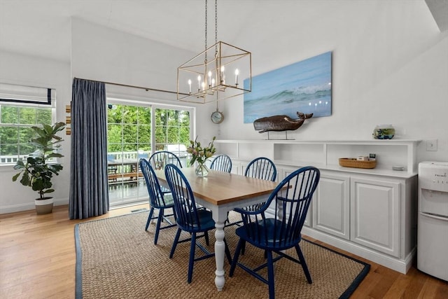 36 Village Way, Duxbury, MA 02332 - dining area featuring plenty of natural light, light wood-type flooring, a chandelier, and baseboards