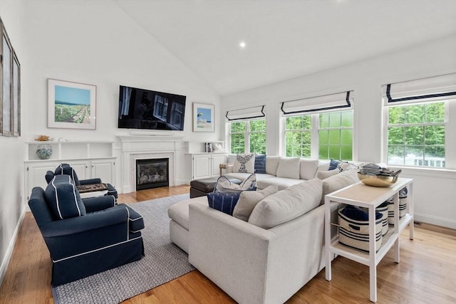 36 Village Way, Duxbury, MA 02332 - living room with healthy amount of natural light, light wood-style flooring, high vaulted ceiling, baseboards, and recessed lighting