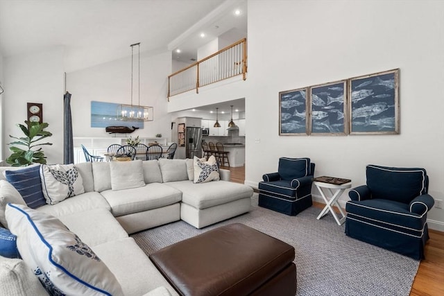36 Village Way, Duxbury, MA 02332 - living room featuring a chandelier, wood finished floors, recessed lighting, baseboards, and high vaulted ceiling