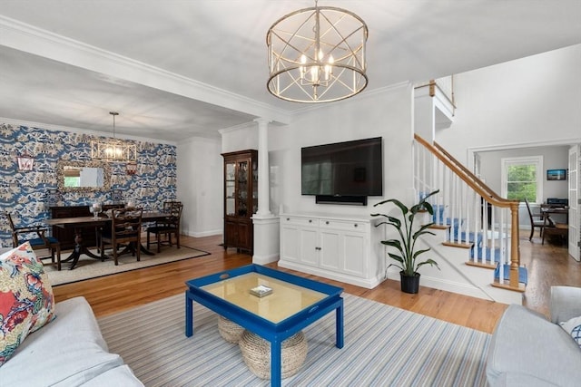 36 Village Way, Duxbury, MA 02332 - living area featuring a chandelier, wood finished floors, stairway, baseboards, and ornamental molding
