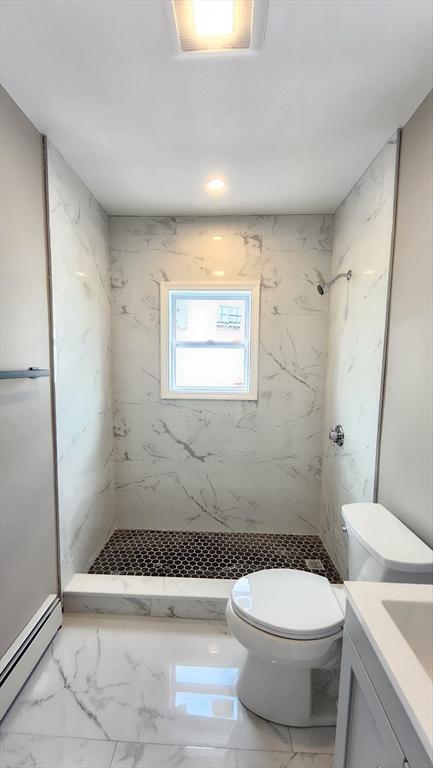 97-99 Blaisdell St Unit 3, Haverhill, MA 01832 - bathroom with a baseboard radiator, marble finish floors, vanity, and a marble finish shower