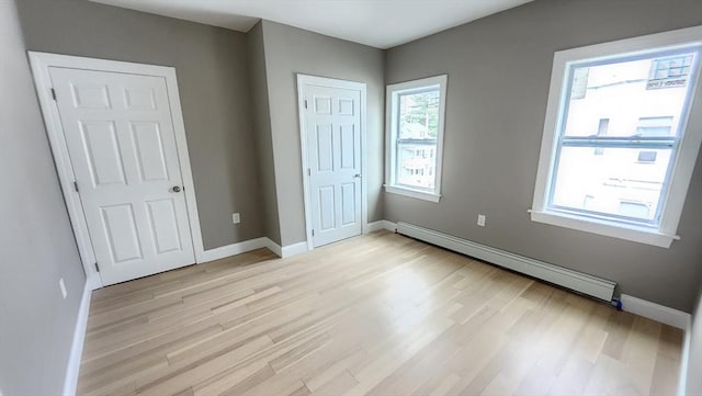 97-99 Blaisdell St Unit 3, Haverhill, MA 01832 - unfurnished bedroom with a baseboard radiator and light wood finished floors