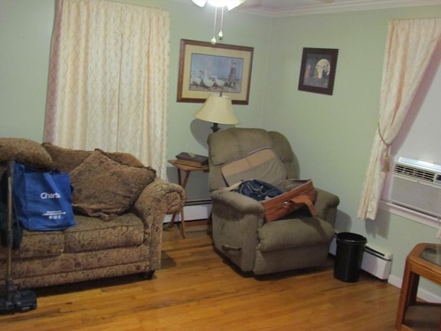 82 Laroche St, Ludlow, MA 01056 - living room featuring wood finished floors, crown molding, a ceiling fan, baseboard heating, and cooling unit