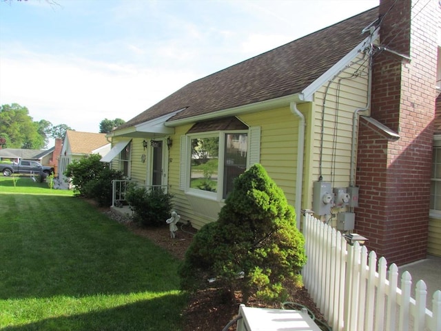 82 Laroche St, Ludlow, MA 01056 - view of property exterior featuring a shingled roof and a chimney