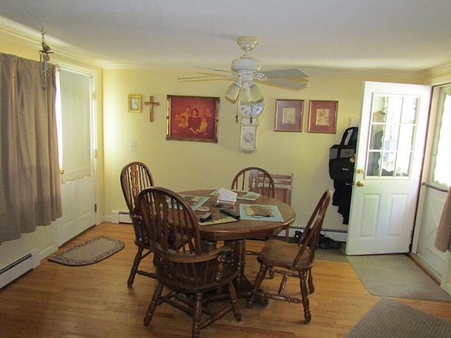 82 Laroche St, Ludlow, MA 01056 - dining room featuring light wood-type flooring, a ceiling fan, baseboard heating, and crown molding