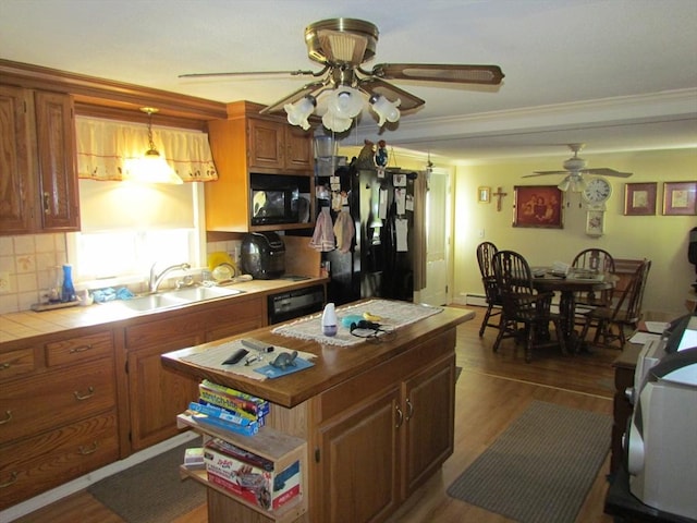 82 Laroche St, Ludlow, MA 01056 - kitchen featuring a ceiling fan, a sink, tile countertops, refrigerator with ice dispenser, and black microwave