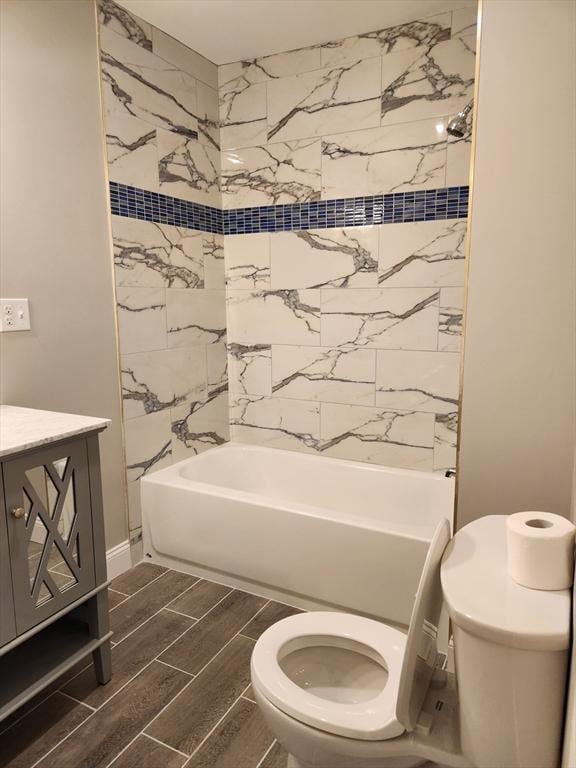 9 Varney St, Worcester, MA 01605 - bathroom featuring wood tiled floors, bathing tub / shower combination, and vanity
