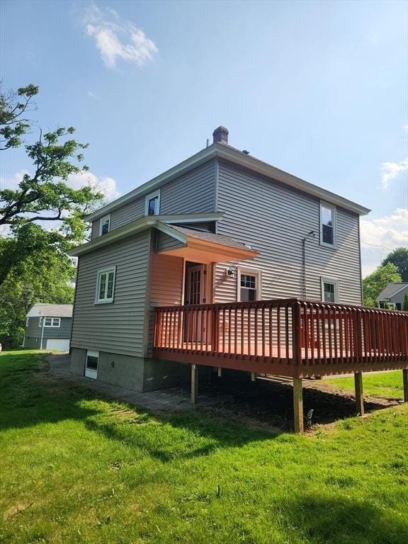 9 Varney St, Worcester, MA 01605 - back of property featuring a deck and a lawn