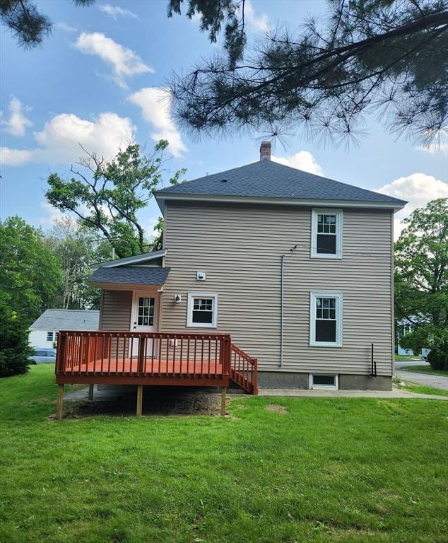9 Varney St, Worcester, MA 01605 - back of property featuring a deck, a yard, a chimney, and a shingled roof