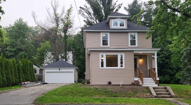 9 Varney St, Worcester, MA 01605 - american foursquare style home featuring an outbuilding, a detached garage, and a chimney