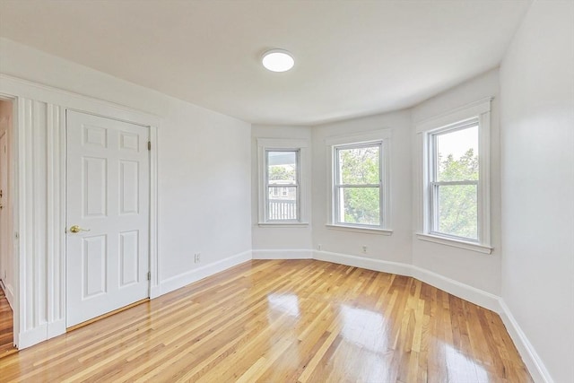 empty room featuring wood-type flooring