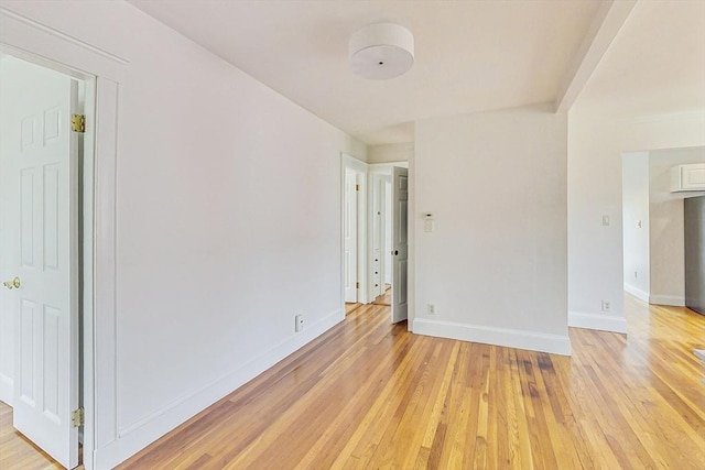 unfurnished room featuring light hardwood / wood-style floors