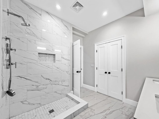 667 Tremont St Unit 2, Boston, MA 02118 - full bath featuring marble look tiles, a marble finish shower, baseboards, and recessed lighting