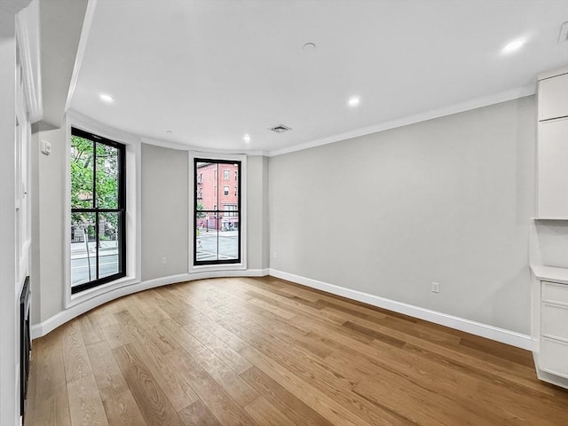 667 Tremont St Unit 2, Boston, MA 02118 - spare room featuring light wood finished floors, baseboards, recessed lighting, and ornamental molding