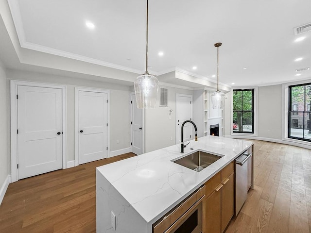 667 Tremont St Unit 2, Boston, MA 02118 - kitchen with a sink, open floor plan, light wood-style flooring, appliances with stainless steel finishes, and recessed lighting