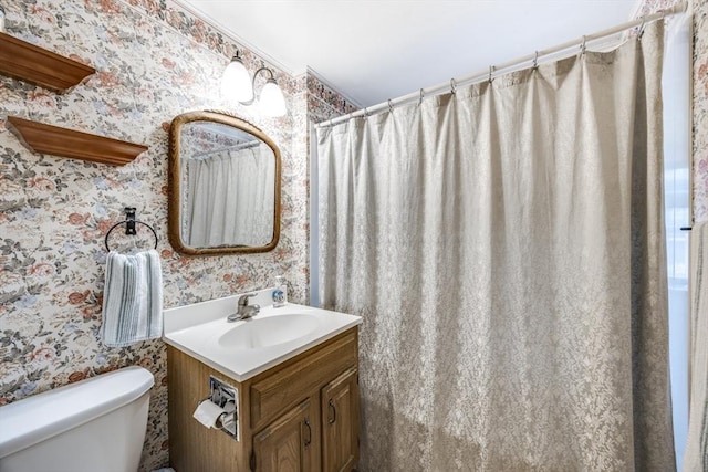 25 First Ave, Wellfleet, MA 02667 - bathroom featuring wallpapered walls, toilet, and vanity