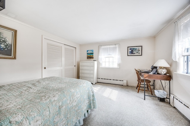 bedroom with baseboard heating, crown molding, a closet, and carpet floors