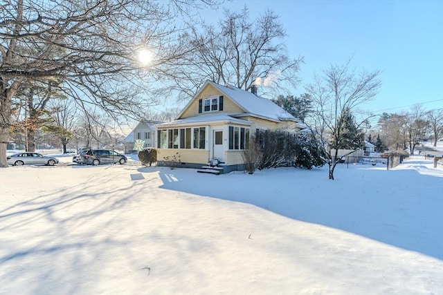 view of snow covered house