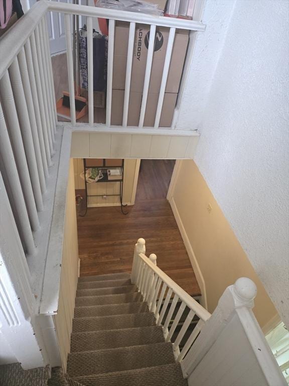 88 Esmond St, Boston, MA 02121 - staircase featuring wood finished floors