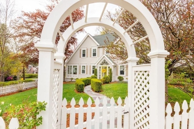 exterior space featuring fence and a front yard