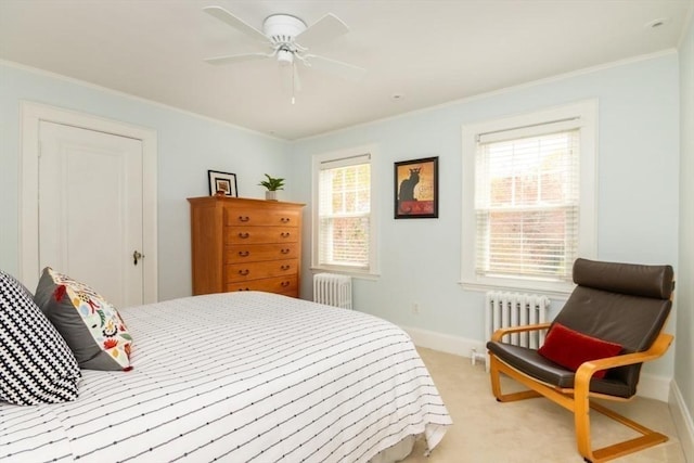 bedroom with radiator, ornamental molding, baseboards, and light carpet