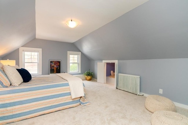carpeted bedroom with radiator heating unit, baseboards, and vaulted ceiling