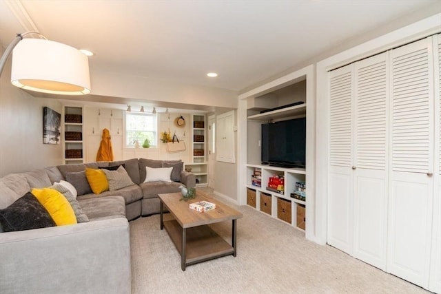 carpeted living room with recessed lighting and built in features