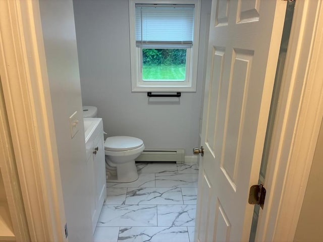 101 E Hadley Rd, Amherst, MA 01002 - bathroom with baseboard heating and marble look tiles