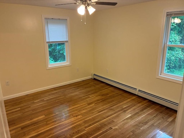101 E Hadley Rd, Amherst, MA 01002 - unfurnished room with a baseboard radiator, plenty of natural light, and wood finished floors