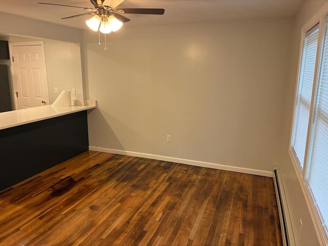 101 E Hadley Rd, Amherst, MA 01002 - unfurnished room with a baseboard radiator, dark wood-style floors, and ceiling fan