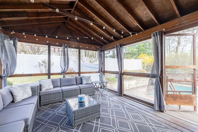 sunroom / solarium featuring outdoor lounge area
