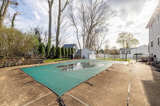 view of pool with a fenced in pool, fence, and a patio area