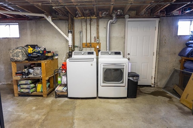 laundry area featuring plenty of natural light, laundry area, and washing machine and clothes dryer