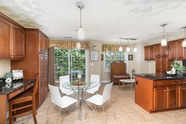 dining area featuring light tile patterned floors