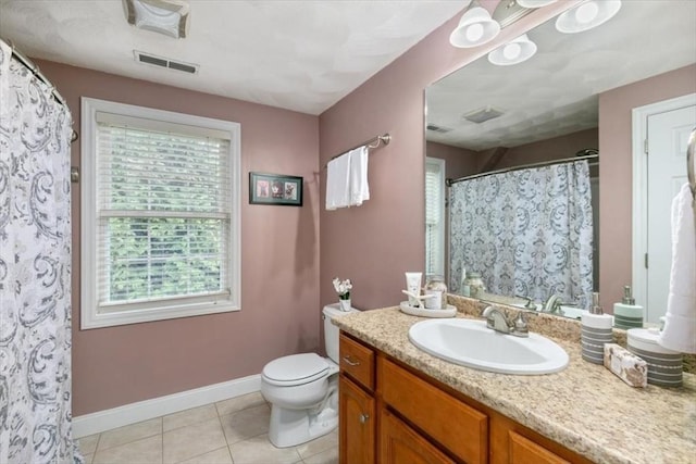 full bathroom featuring plenty of natural light, baseboards, tile patterned floors, and toilet