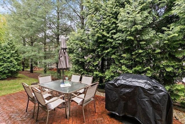 view of patio featuring grilling area and outdoor dining area