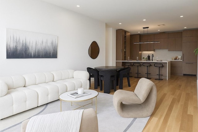 58 Kent St Unit 404, Brookline, MA 02445 - living area with light wood-type flooring and recessed lighting