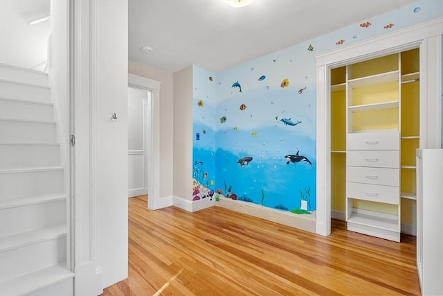 unfurnished bedroom with light wood-style floors and baseboards