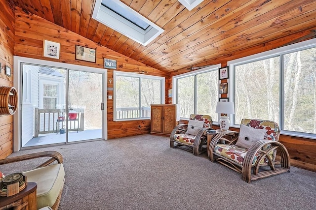 sunroom featuring vaulted ceiling with skylight, wooden ceiling, and plenty of natural light